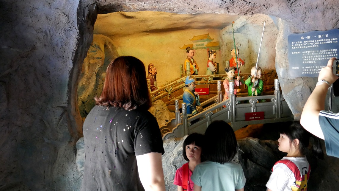 Visitors to the ‘Ten Courts of Hell’ attraction at Haw Par Villa.